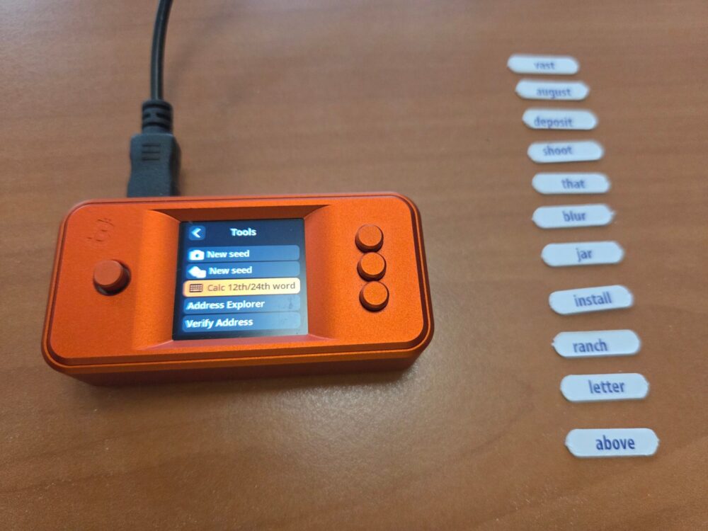 Shuffle Seed with a SeedSigner SeedSigner calculating the checksum word next to drawn BIP39 chips