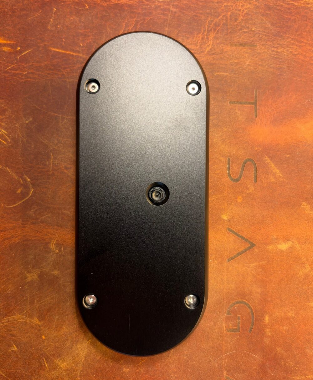 Back of the black SeedSigner+ Premium, machined aluminium plate with the camera opening