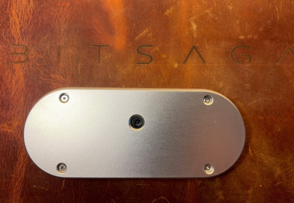 Silver machined aluminium back plate of the SeedSigner+ Premium